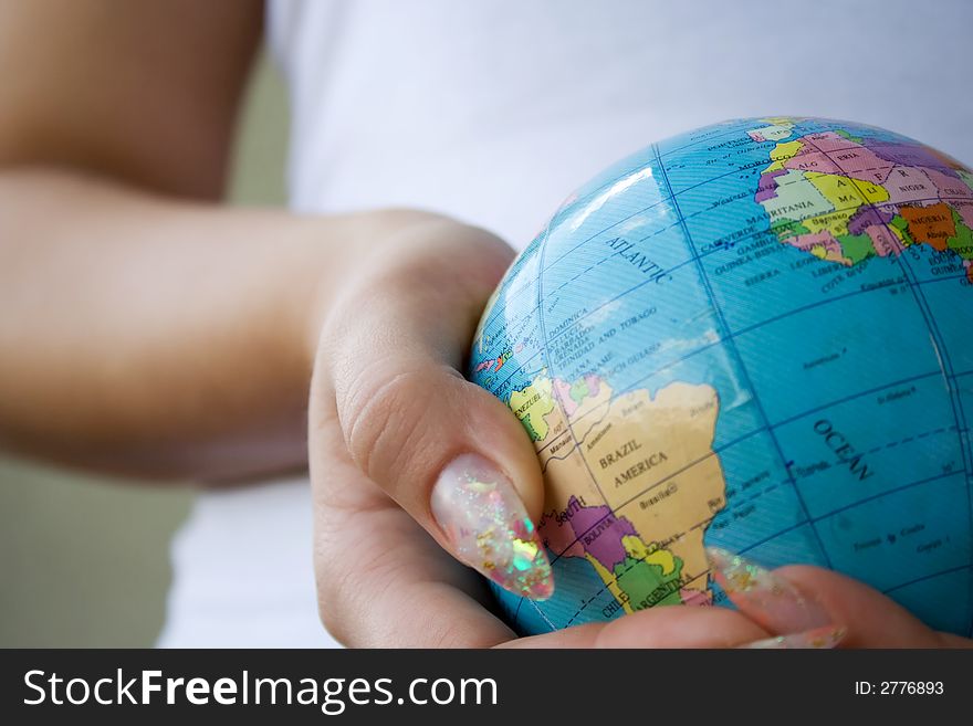 Girl holding globe in hands