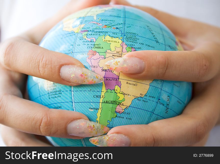 Girl holding globe in hands