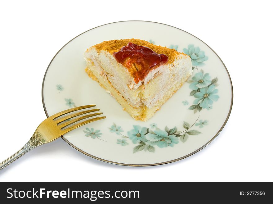 Cake on plate and fork, isolated on white background