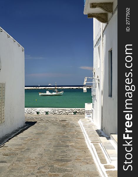 Mikonos harbor with small fishing vessel