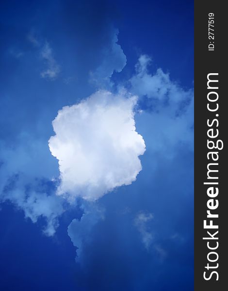 Abstract of deep blue sky with white fluffy cloud