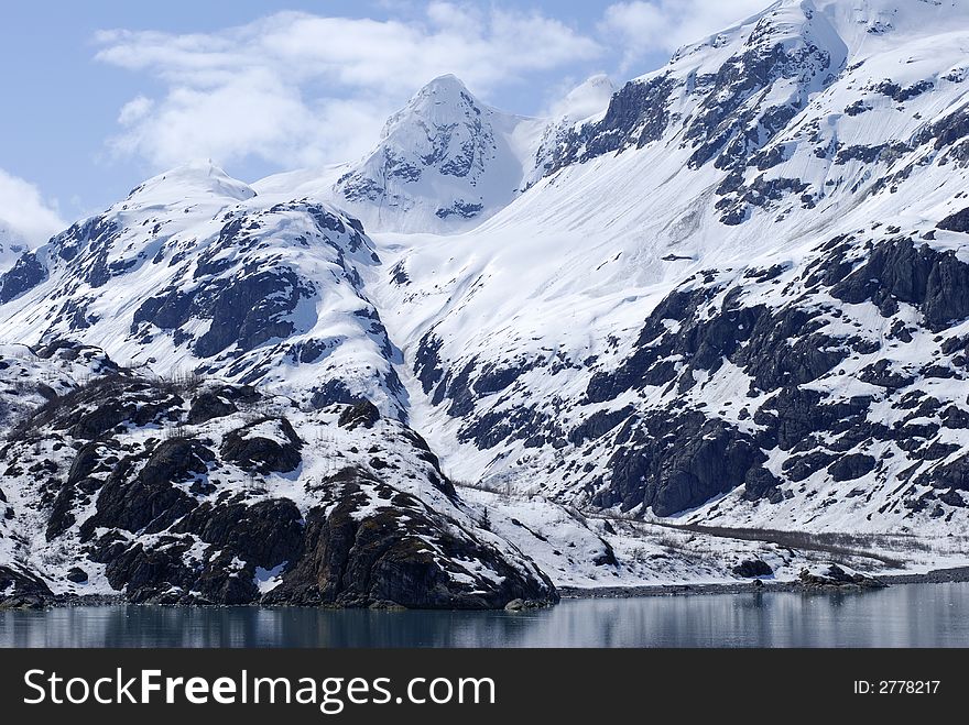 Snow-covered beach in Glacier Bay national park, Alaska. Snow-covered beach in Glacier Bay national park, Alaska.