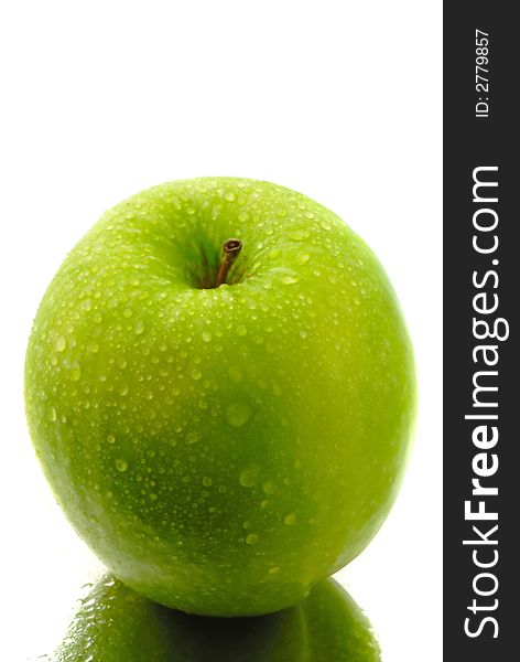 Green apple covered drop of water on white background