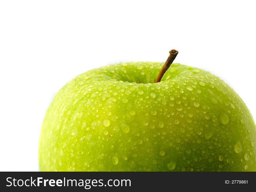 Big green apple covered  drop of water on  white background