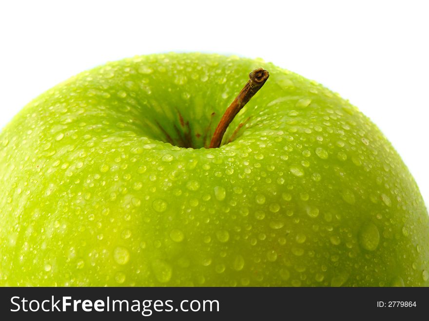 Big green apple covered  drop of water on  white background