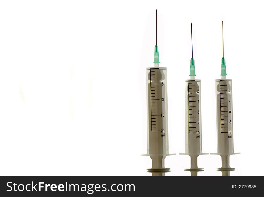 Three disposable syringes are isolated on  white background. Three disposable syringes are isolated on  white background