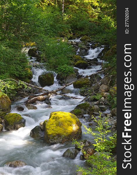 Waterfall cascading spring in the mountains