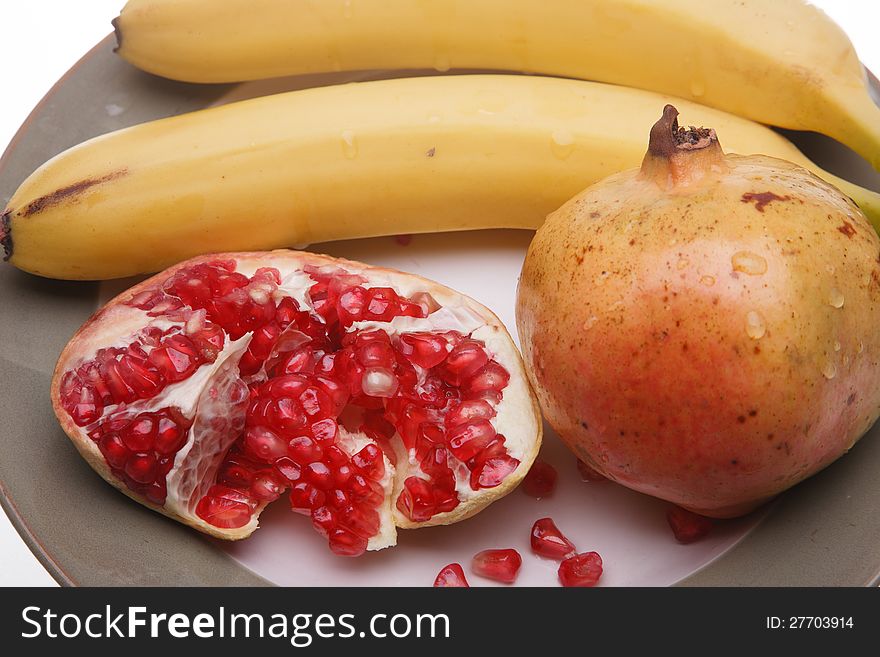 Yellow bananas and red pomegranate
. Yellow bananas and red pomegranate