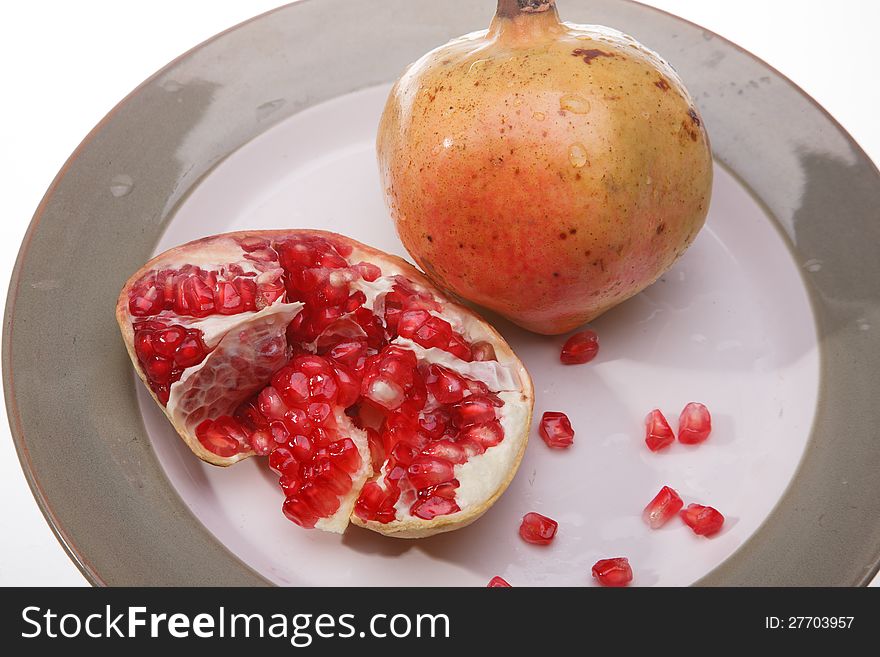 Yellow bananas and red pomegranate. Yellow bananas and red pomegranate