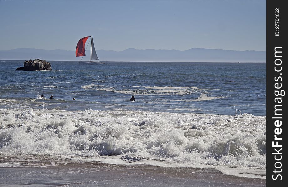 Surfers wating for wave in Pacific Ocean