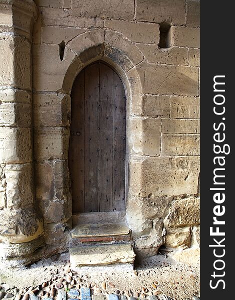 Old wooden door in the Warwick castle, England. Old wooden door in the Warwick castle, England