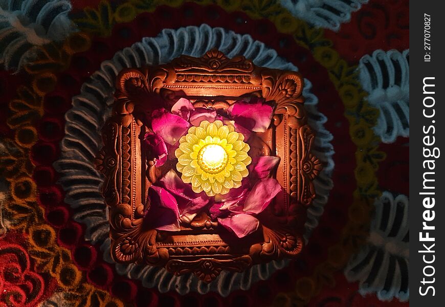 Lighting diyas during Diwali is believed to bring good luck, prosperity, and happiness to the household.