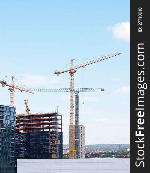 Construction site overview in a city, towards blue sky