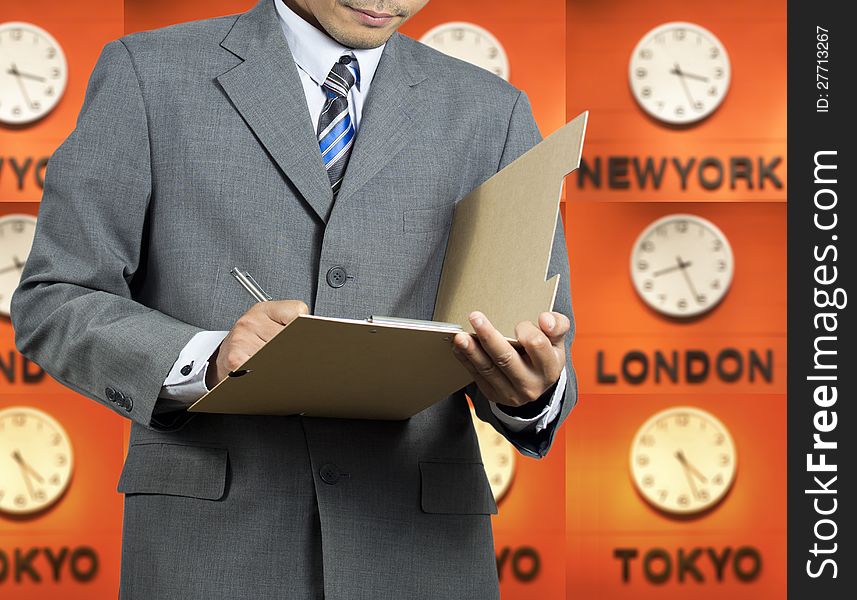 Businessman signing document and time