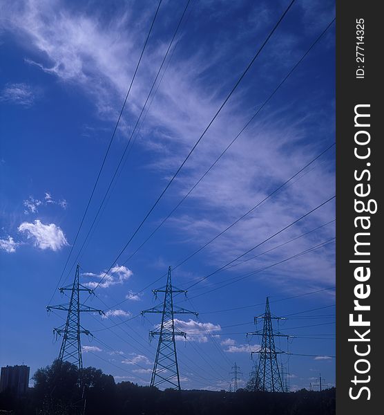 Electric power lines against the blue sky. Electric power lines against the blue sky.