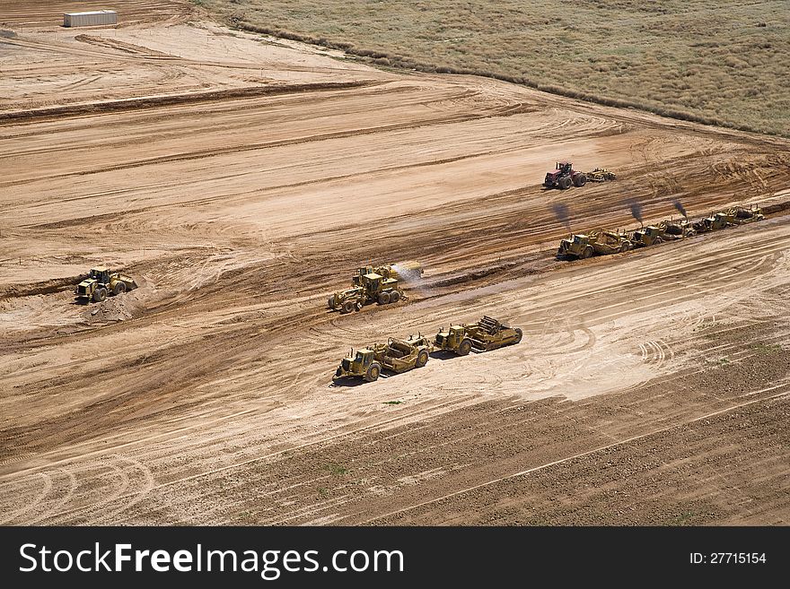 Grading of landfill with heavy equipment from above