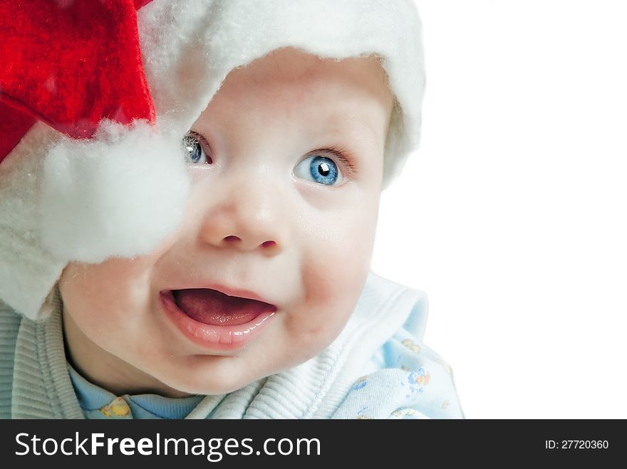 Portrait of a baby in a Christmas hat Sata Claus