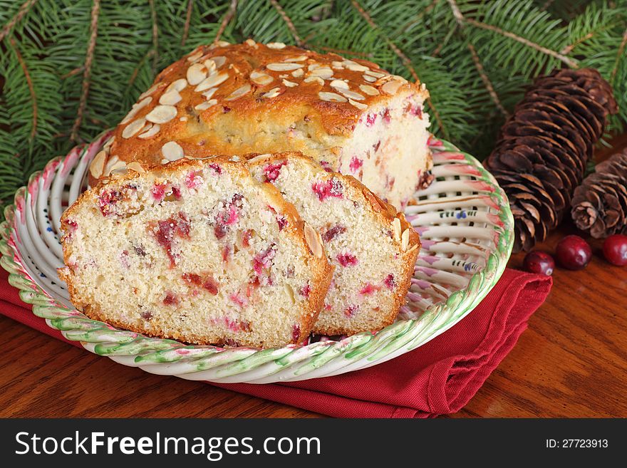 Sliced cranberry almond Christmas bread on a plate. Sliced cranberry almond Christmas bread on a plate
