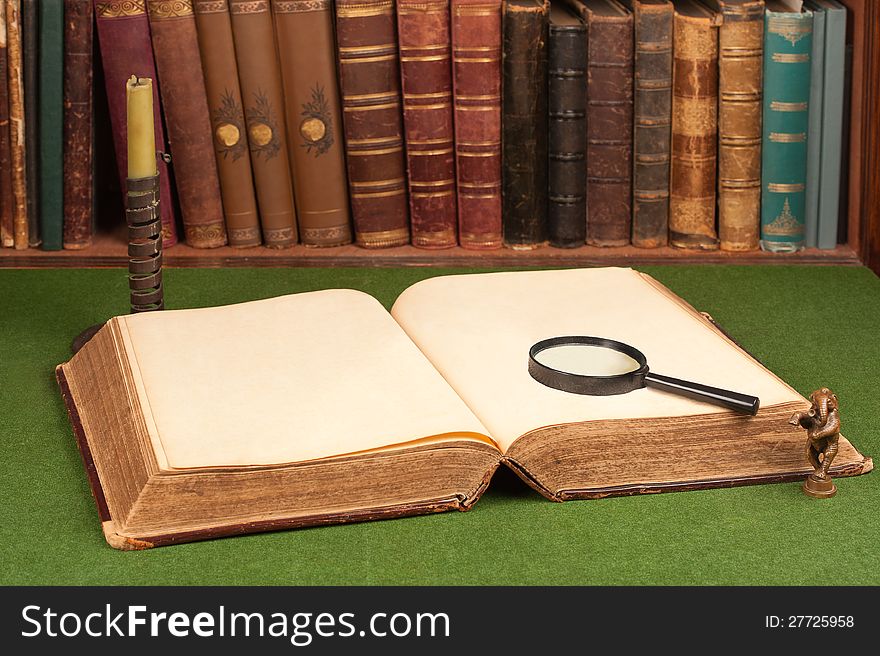 Leather Books, Candlestick, Magnifying Glass