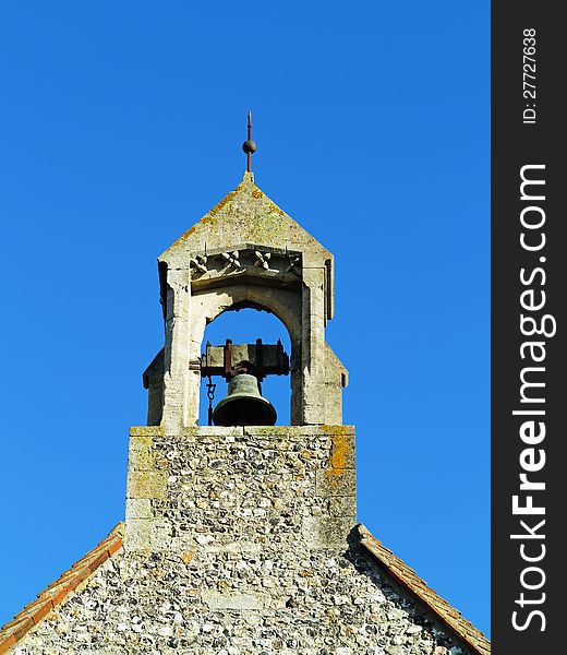 English Village Church Bell Tower against a Blue Sky. English Village Church Bell Tower against a Blue Sky