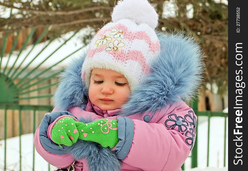 The Child In Warm Clothes Outdoors
