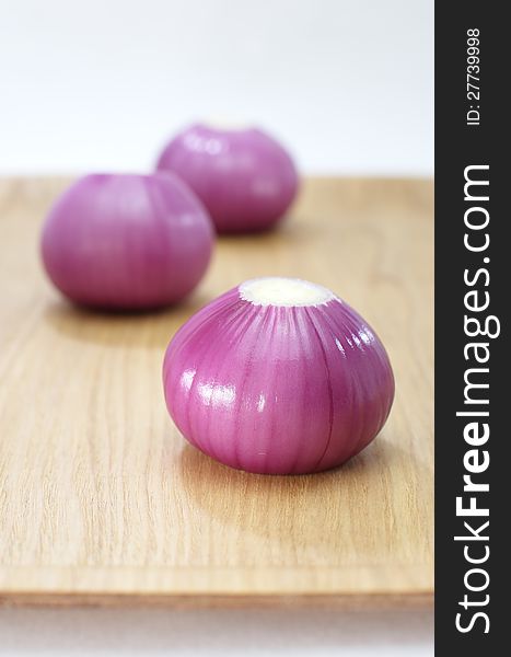 Red onion closeup on white background