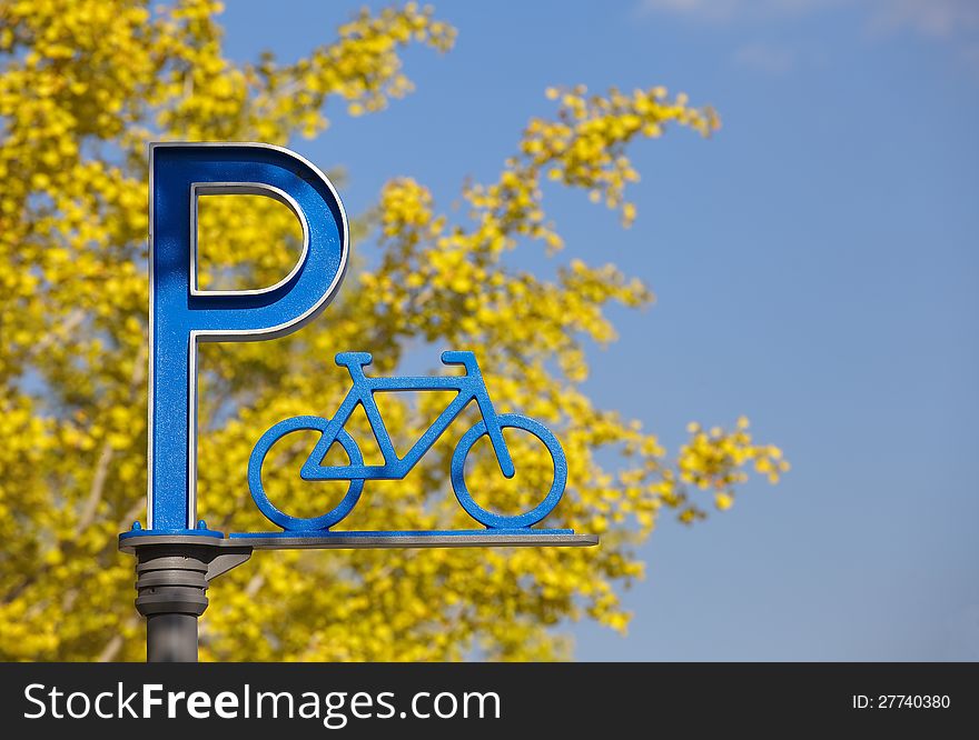 Bicycle parking with yellow leaf and blue sky