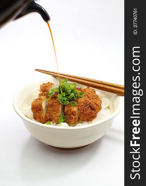 Fried chicken and rice on white background