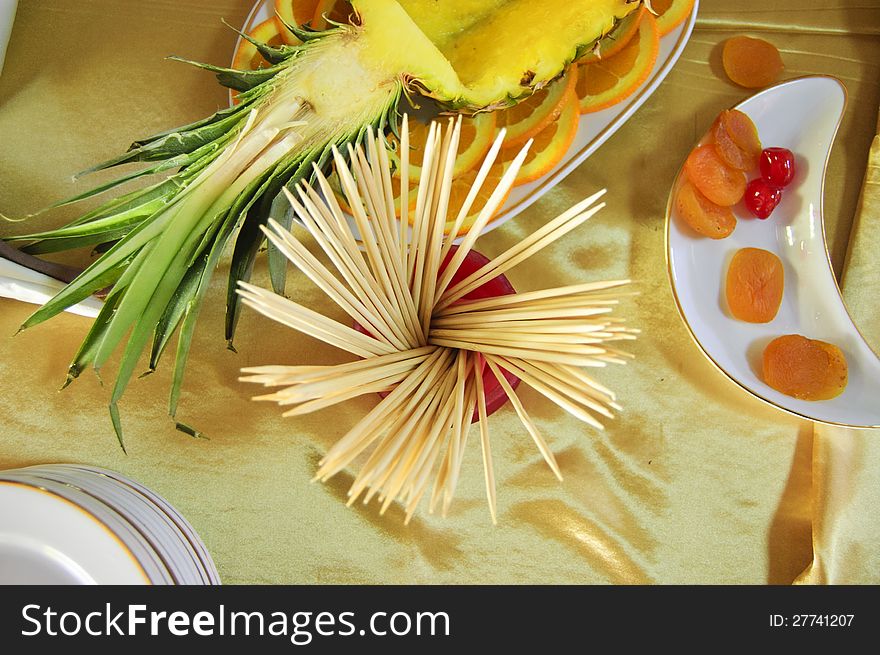 Assorted fruit of ananas and orange with dried fruits of apricots and cherry