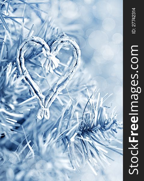 Fir branch and heart shape in blue