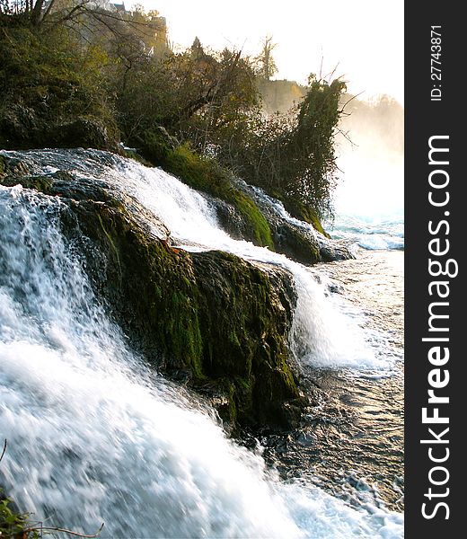 Rheinfall waterfall at sunset near Schaffhausen in Switzerland. Rheinfall waterfall at sunset near Schaffhausen in Switzerland.