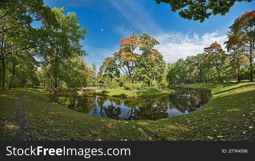 Autumn trees near the pond in the park. Autumn trees near the pond in the park