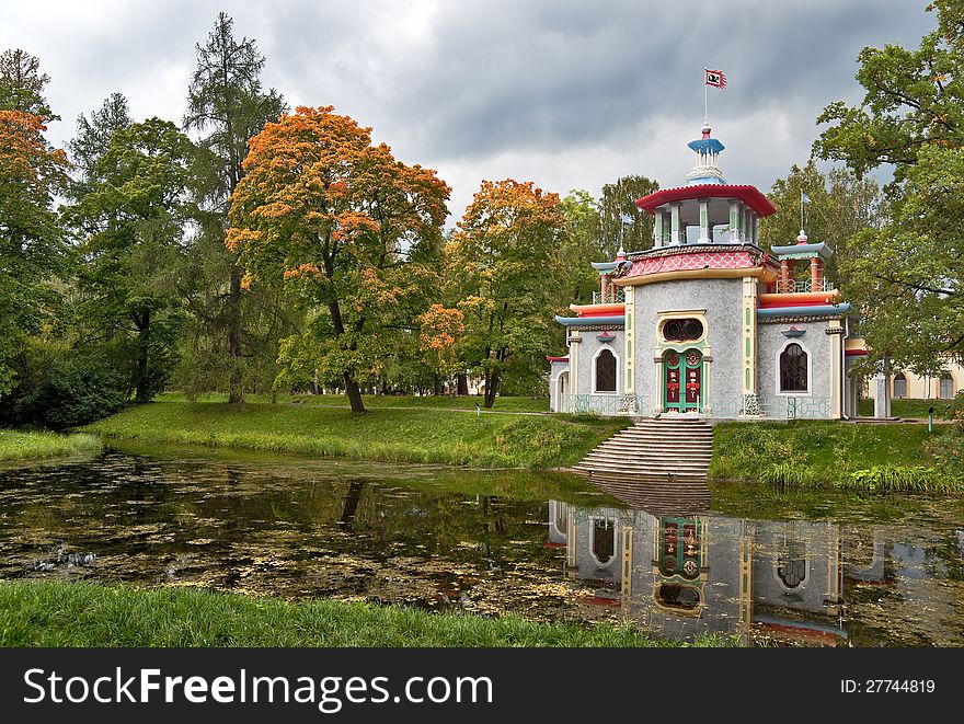 Chinese pagoda pavilion next to the autumn pond in the park. Chinese pagoda pavilion next to the autumn pond in the park