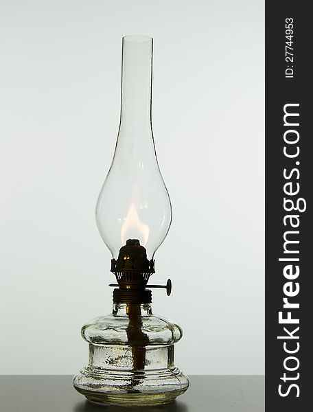 Old vintage oil lamp isolated on white background