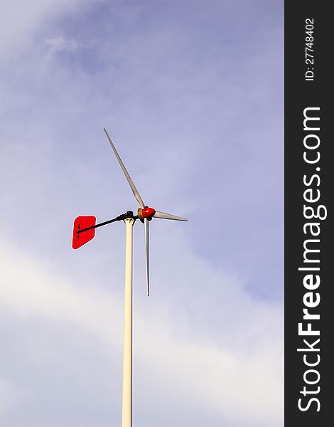 Wind turbine located in school with twilight blue sky background