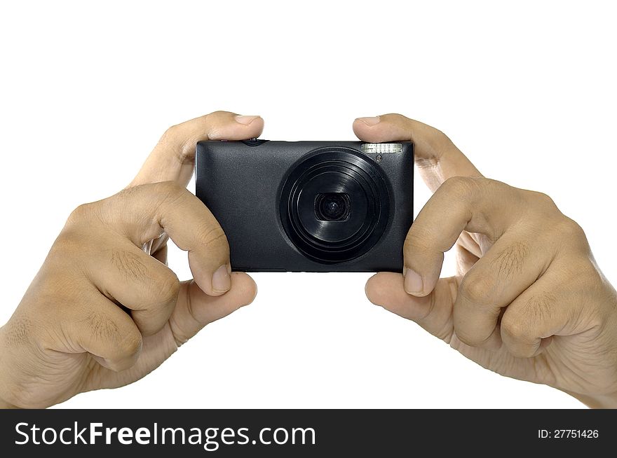 Man hand holding compact digital camera isolated over white background. Man hand holding compact digital camera isolated over white background