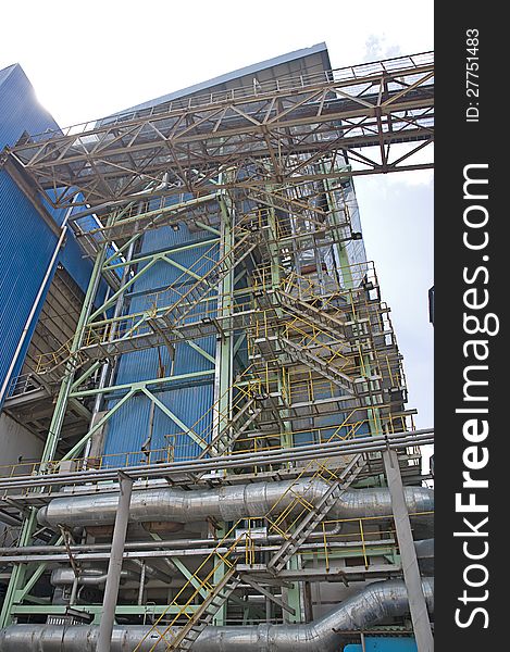 Power plant factory detail shot with blue sky background. Power plant factory detail shot with blue sky background