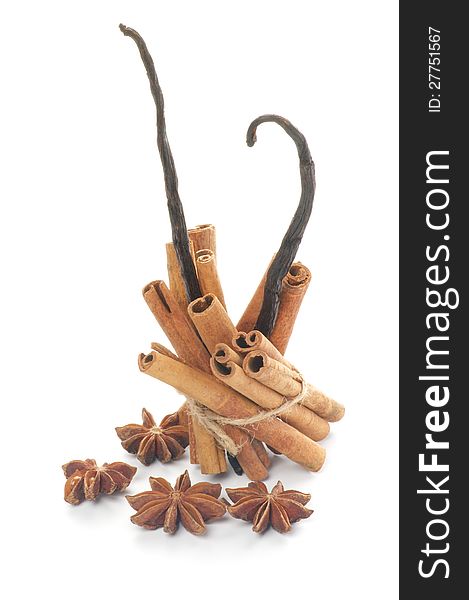 Arrangement of Cinnamon Sticks, Anise Star and Vanilla Pods isolated on white background