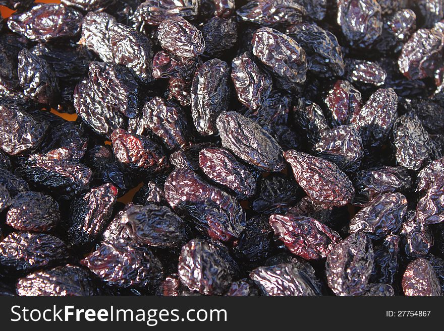 Pile of dried plums and smoked lighted. Pile of dried plums and smoked lighted.