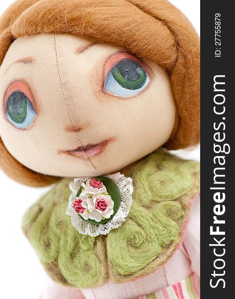 Handmade toy cute litlle girl with big eyes isolated. Handmade toy cute litlle girl with big eyes isolated