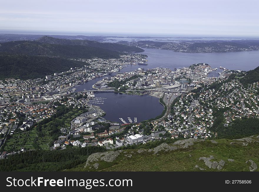 From Mount Ulriken one has a magnificent view over the old town of Bergen in the fjord area of Norway. In the foreground we can see the densely populated area of Bergen and its suburbs while we can even see the Atlantic on the horizon. From Mount Ulriken one has a magnificent view over the old town of Bergen in the fjord area of Norway. In the foreground we can see the densely populated area of Bergen and its suburbs while we can even see the Atlantic on the horizon.