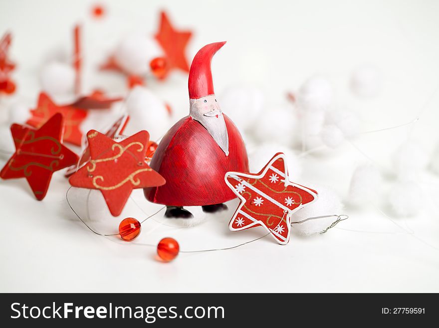 A chubby Santa Claus standing with a stars ribbon around him on white background. A chubby Santa Claus standing with a stars ribbon around him on white background