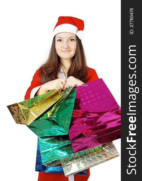 Pretty teen lady dressed as Santa with presents isolated