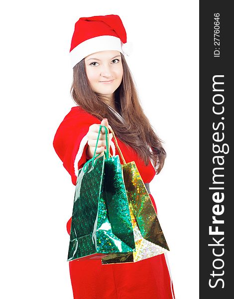 Pretty teen girl dressed as Santa gives gifts isolated