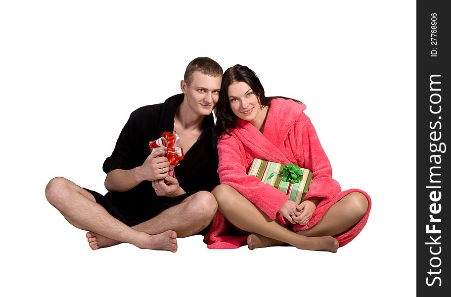 Young couple in robe isolated on white background