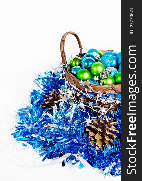 Christmas decoration with different balls and tinsel on white background