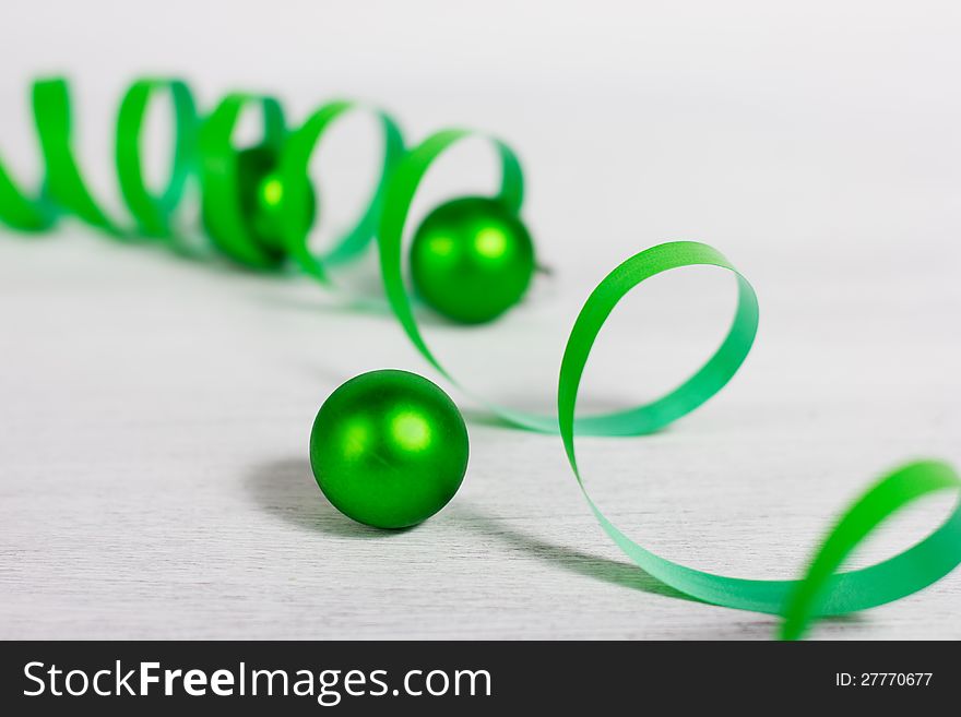 Christmas decoration with green elements on rusty white background