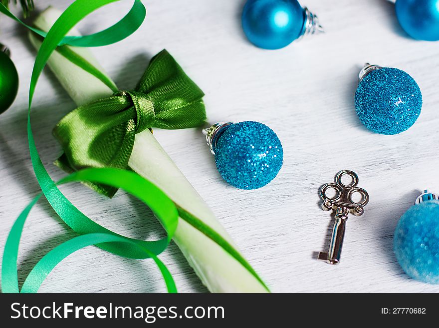 Christmas decoration with lollipop and blue balls on rusty white background