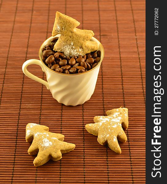 White cup of coffee with cookies on the brown background. White cup of coffee with cookies on the brown background