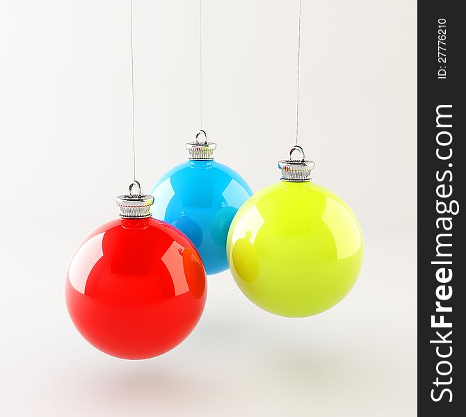 Red blue green Christmas balls hanging over white background